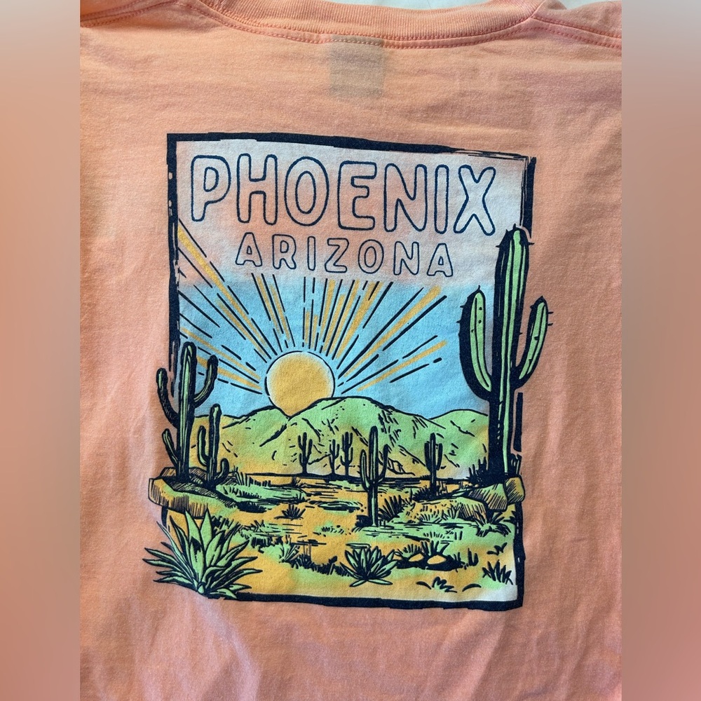 Phoenix peach-colored long-sleeve t-shirt with a desert graphic